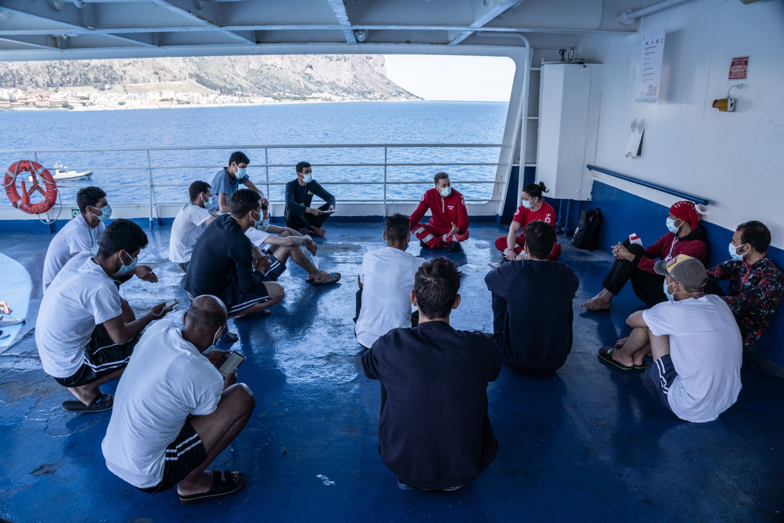 The ship's residents take part in a group psychotherapy session