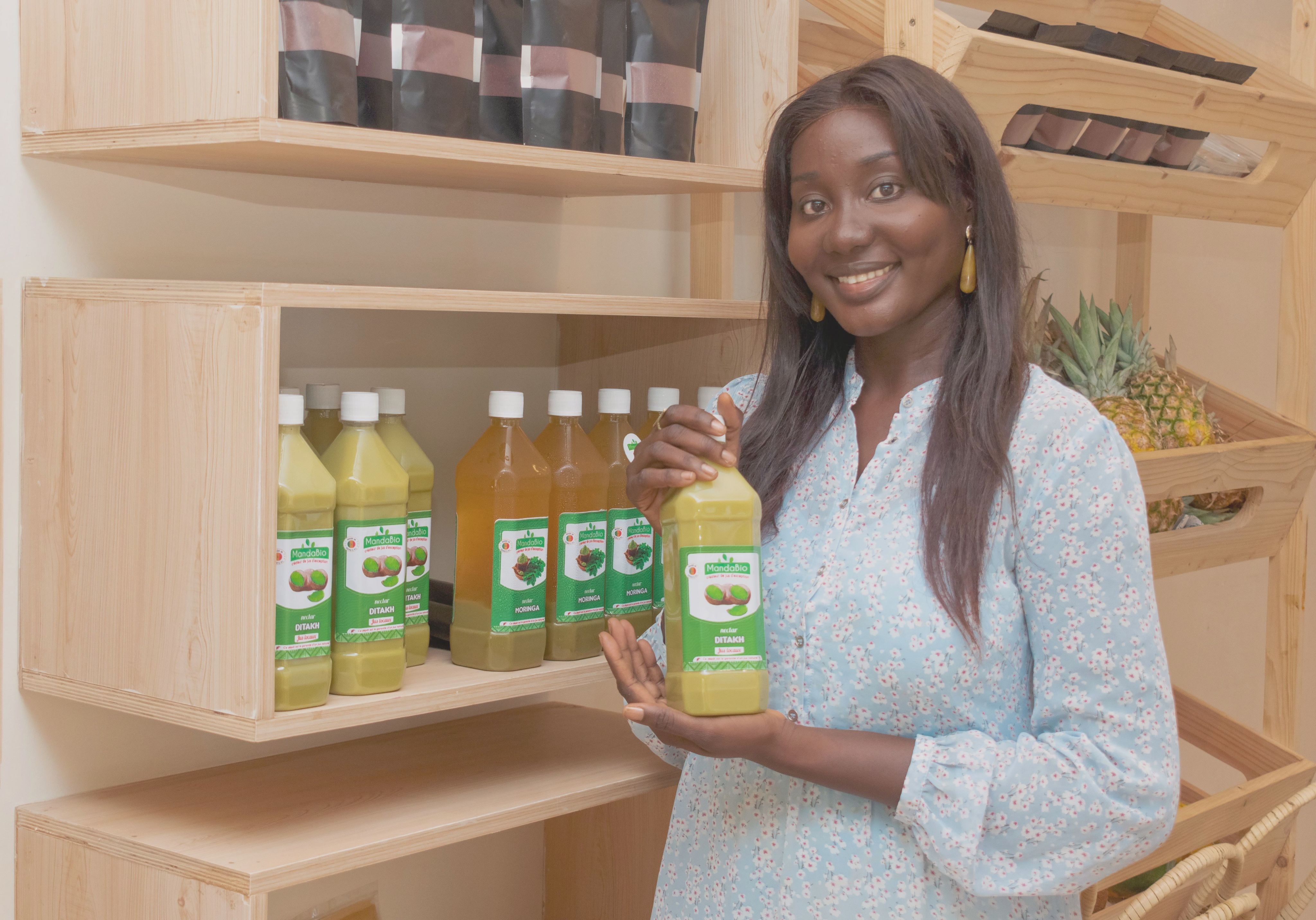 african woman entrepreneur with her juice business
